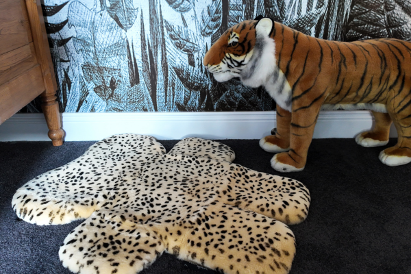 sheepskin baby rug in a jungle themed nursery